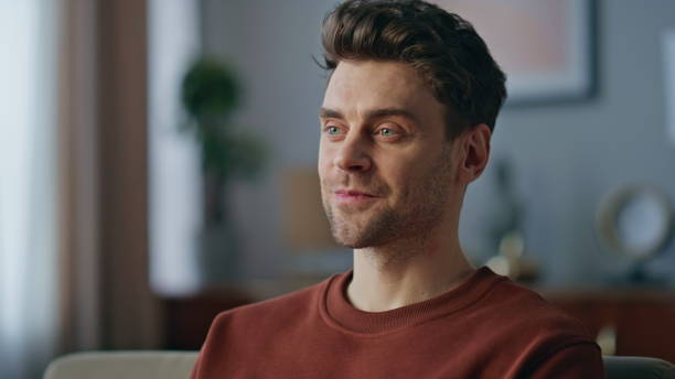 istock Portrait smiling guy typing laptop keyboard at home sofa. Handsome man chatting 2148688756
