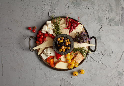 Cheese Plate Over Grey Stone Background