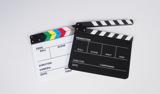 Two Clapper board or movie slate on white background.