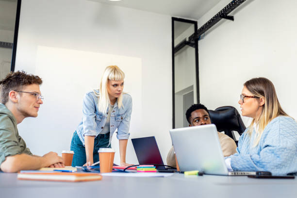 istock Diverse group of young people working on new project together in office. 2148690167