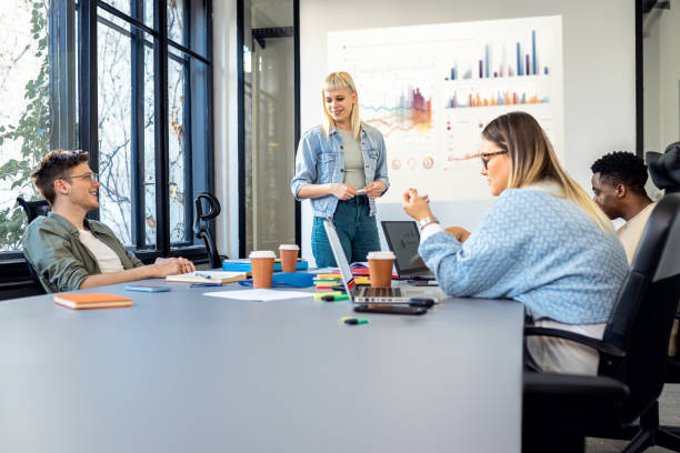 istock Diverse group of young people working on new project together in office. 2148690175