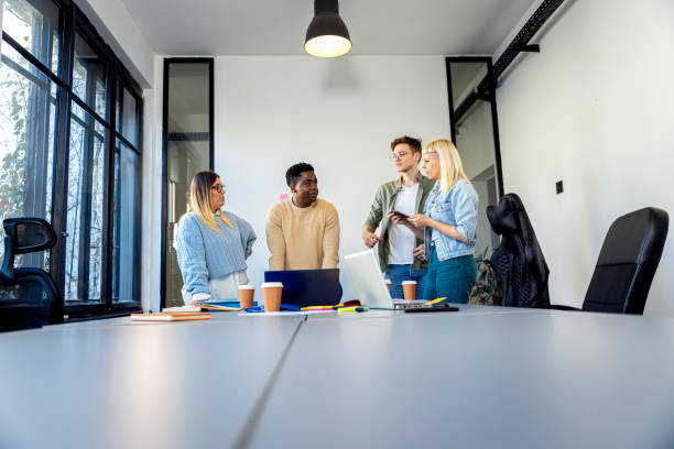 istock Diverse group of young people working on new project together in office. 2148690195