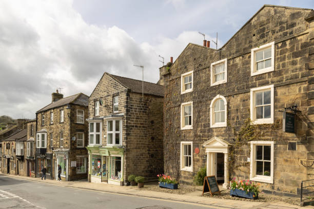 Photo of the beautiful town of Richmond which is a market town and civil parish in North Yorkshire, England showing the historic old houses in the summer time