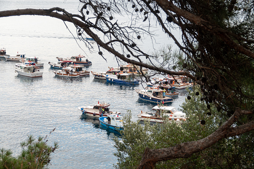 Canakkale, Turkey, Nov. 12, 2023 Small fishing boats anchored on the Kilitbahir coast. Kilitbahir is an old fishing town of Çanakkale.