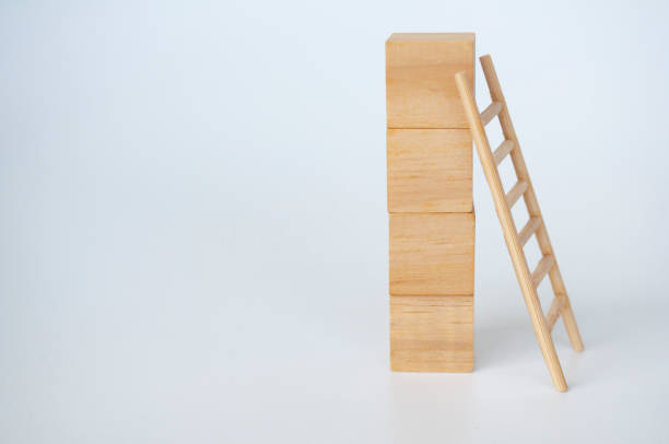 istock Wooden cubes with ladder on white background with customizable space for text 2148691472