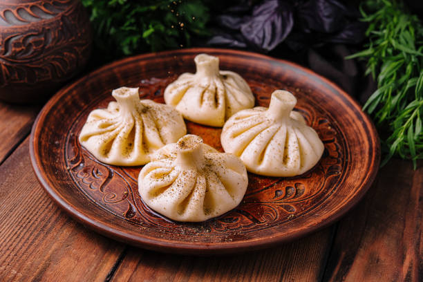 istock Georgian khinkali on traditional plate 2148691582