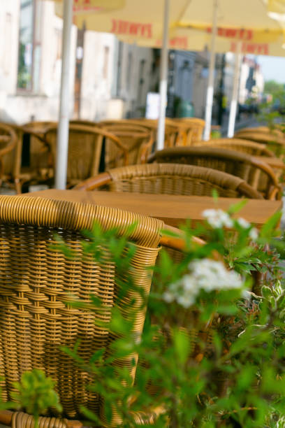 Wicker chairs on the terrace in a cafe. The interior and atmosphere of the cafe.