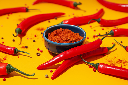 Concept of hot and spicy ingredients - red hot chili pepper