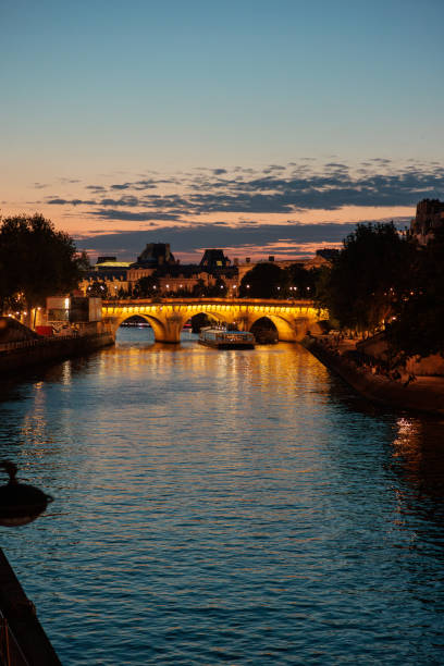 istock Romantic view on illuminated Pont Neuf on Seine river in Paris at dusk 2148692664
