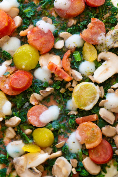 istock Frozen pizza with spinach and mushrooms, close-up. 2148692726