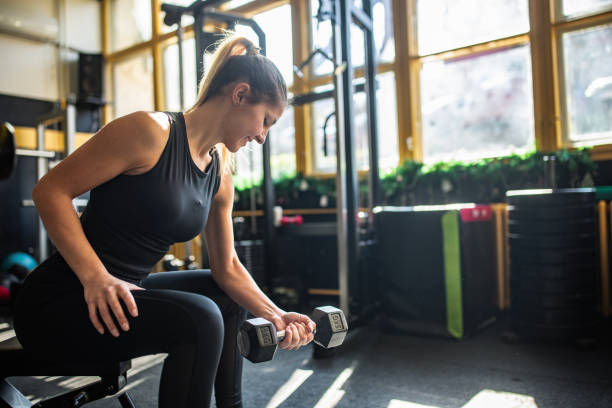 istock Woman exercising with dumbbell 2148694500