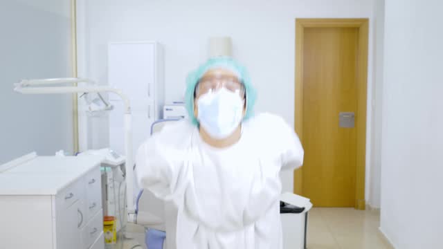 Joyful Healthcare Professional Dancing in Medical Room