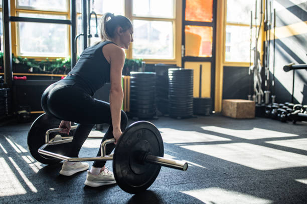 istock Strong woman weightlifting 2148695404