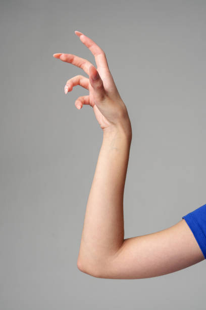 istock Female hand sign against gray background in studio 2148695649