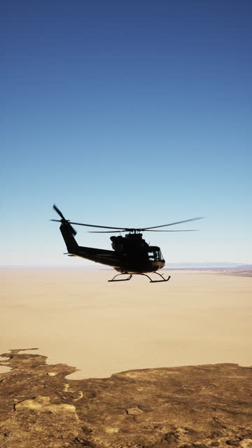 Helicopter Flying Over Desert Plain