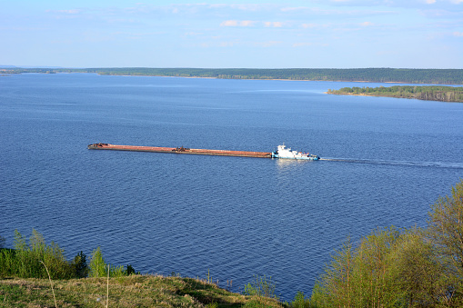 a large ship is traveling on the water in the middle of the lake