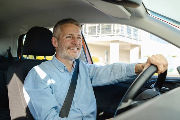 istock Smiling mature driver in the car 2148696946