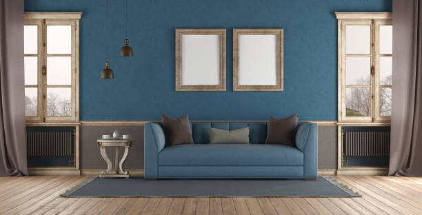istock Elegant living room interior with blue sofa and blank frames 2148697220