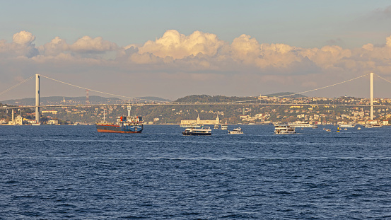 Istanbul, Turkey - October 19, 2023: 15 July Martyrs First Bridge Over Bosphorus Canal at Sunny Fall Day Cityscape.