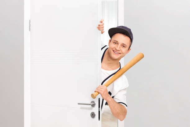 Baseball player with bat on white background