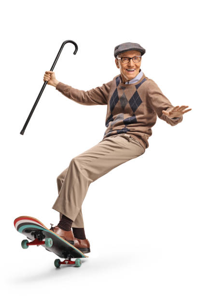 istock Happy elderly man riding a skateboard and holding a cane 2148701317