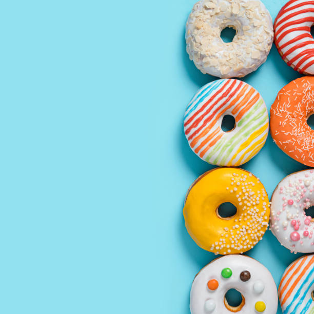 istock Glazed donuts on colorful background, top view 2148702080