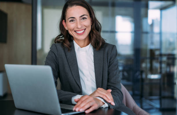 istock Successful businesswoman in modern office working on laptop. 2148703126