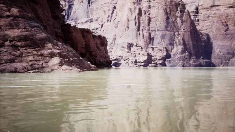 A breathtaking view of a serene lake nestled within towering cliffs