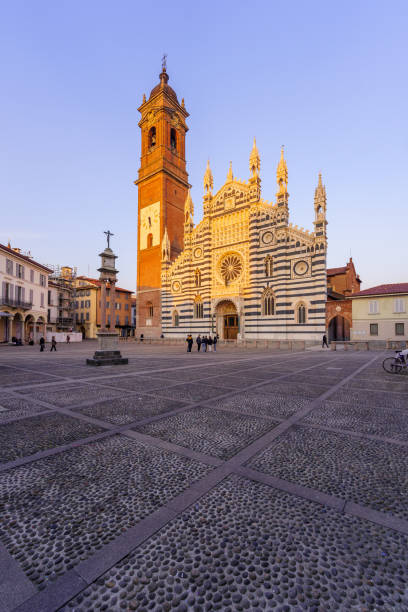 Gothic cathedral facade and bell tower on blue sky, Monza, Lombardy, Italy