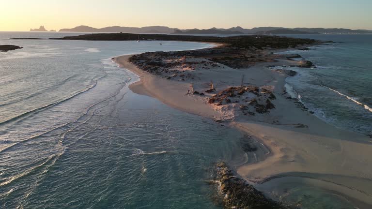 Espalmador beach, Formentera, at sunset. Ibiza and Es Vedra in the background.