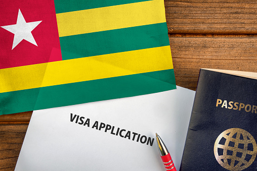 Visa application form, passport and flag of Togo