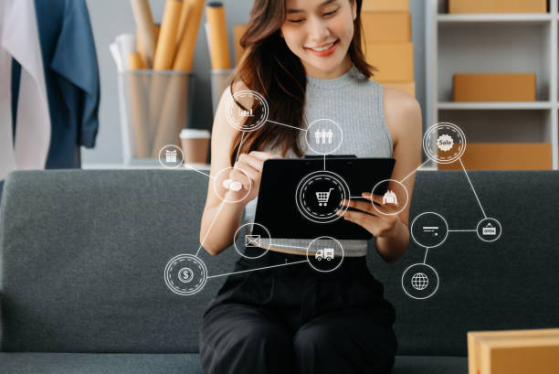 istock Young woman running online store Startup small business SME, using smartphone or tablet taking receive and checking online purchase shopping 2148710032