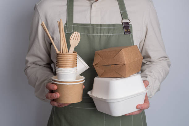 istock Man holding paper tableware. Eco-friendly packaging. Zero waste, ecology and recycling concept. 2148710105