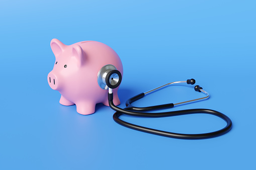 Black stethoscope on the body of a pink piggy bank in blue background. Illustration of the concept of financial health and long-term sustainability of a company