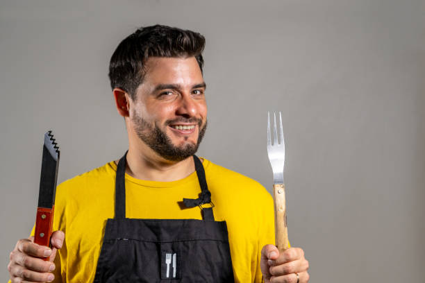 istock Young butcher with his utensils in his hand. 2148710971