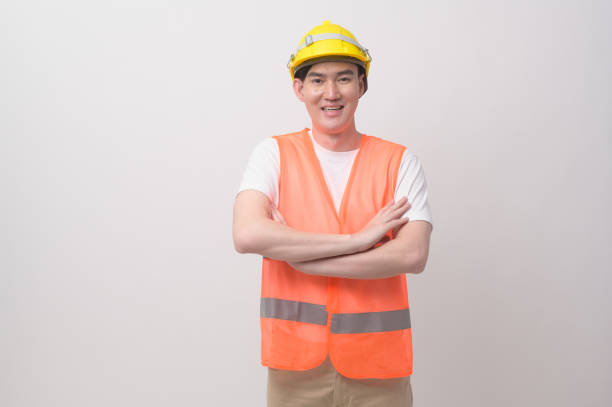 istock Portrait of male engineer wearing a protective helmet over white background studio. 2148711161
