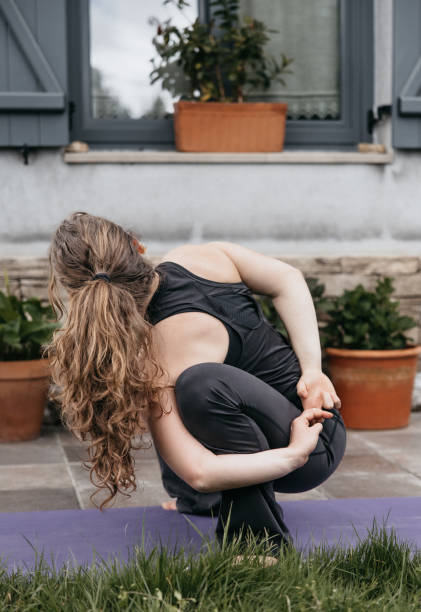 istock Young woman preparing for next yoga pose. 2148711175