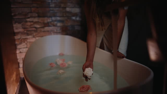 Woman In Bath Touches Roses,Water Flows Serenely