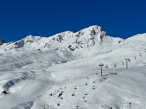 Snow-capped alpine peak Plattenhorn (2554 m) in the Plessur Alps mountain range (Plessuralpen or Plessurgebirge) and over the tourist resort of Arosa - Canton of Grisons, Switzerland (Schweiz)