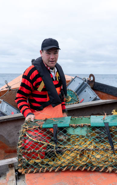 istock Young fisherman looking at camera ready to work 2148718346