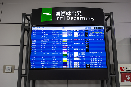 Tokoname, Japan - March 25, 2024 : Flight information board at Chubu Centrair International Airport in Tokoname, Aichi Prefecture, Japan.