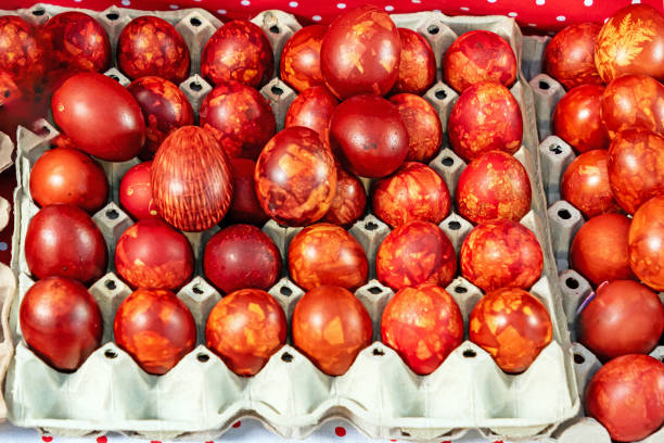 Chicken eggs painted red for Ester on white. High quality photo