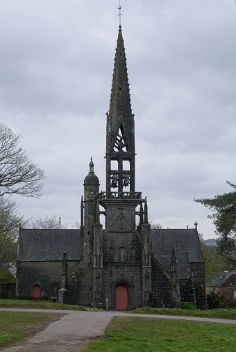 Le Faou, France - Apr 6, 2024: Eglise Notre Dame De Rumengol. Cloudy spring day. Selective focus