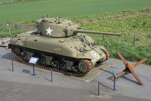 Plougonvelin, France - Apr 7, 2024: Sherman M4A1 76W tank. Graf Spee Battery Fire Control Post during the Second World War. Sunny spring day. Selective focus