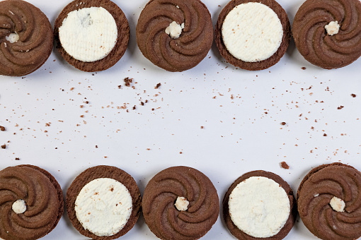 A close-up photo of two delectable chocolate cookies with a rich, creamy filling