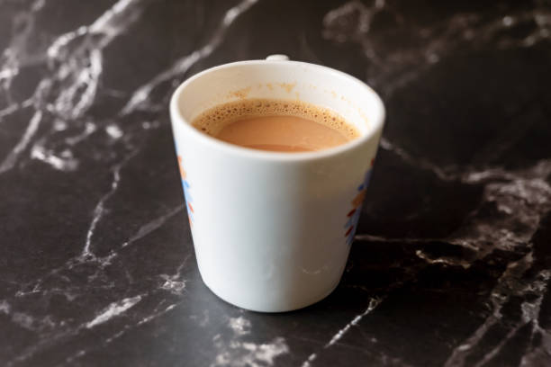 istock A Coffee cup on black marble background Coffee break concept 2148722377