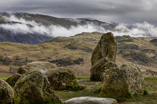 castlerigg stone circle keswick cumbria close up looking east towards low rigg and clough head in low cloud