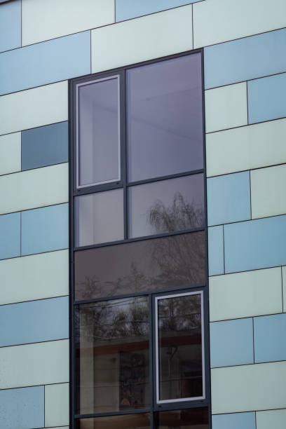istock facade of an modern large house ,wall with windows 2148723589