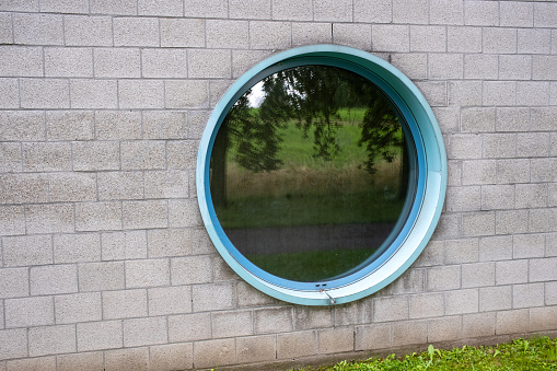 round window in a concrete wall