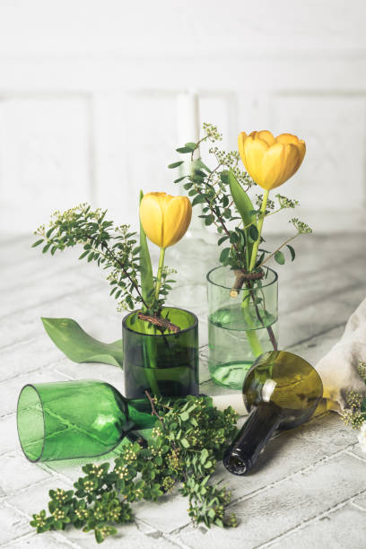 istock Candlesticks and vases on a white background, decoration made from green wine bottles, craft tip 2148725013